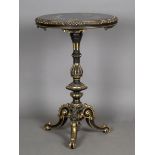 A mid-Victorian ebonized and parcel gilt circular wine table, the top inset with a pietra dura black