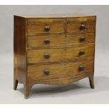An early Victorian mahogany and satinwood crossbanded bowfront chest of two short and three long