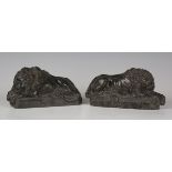 A pair of late 19th/early 20th century carved green marble models of recumbent lions, after