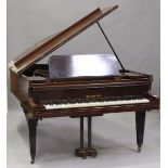 An early 20th century mahogany cased grand piano by Neumeyer, overstrung, raised on square