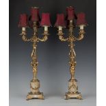 A pair of late 19th century white marble and ormolu four-light candelabra, the scrolling branches