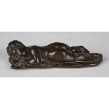 A 19th century patinated cast copper figure of a recumbent sleeping infant, length 14cm.Buyer’s