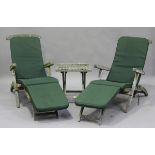 A pair of late 20th century teak folding garden steamer chairs, fitted with loose cushions, height