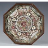 A 19th century sailor's shell valentine of typical octagonal form, the glazed case enclosing a