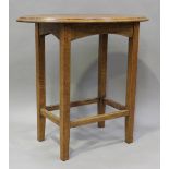 An Edwardian Arts and Crafts oak oval lamp table, raised on tapered block legs, height 63.5cm, width