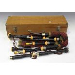 A set of early 20th century Scottish bagpipes with nickel and ivory mounts, the rosewood chanter