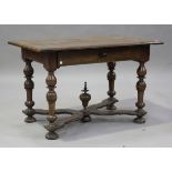 A late 17th/early 18th century Continental walnut side table, fitted with a drawer, raised on turned