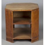 An early 20th century Heal & Son Ltd oak book table, the canted square top above open shelves, the