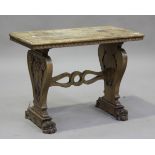 An early 20th century Italian walnut occasional table, raised on twin supports carved with