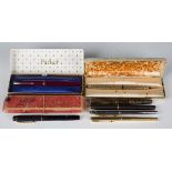 A selection of seven fountain pens, comprising a Parker Vacumatic with striped body, another Parker,
