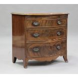 A 20th century George III style mahogany serpentine fronted bachelor's chest of three long