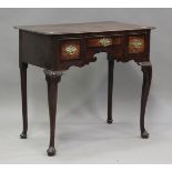 An early 18th century oak lowboy, the mahogany banded top above three drawers, on cabriole legs