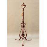 A late Victorian Arts and Crafts painted wrought metal adjustable lamp standard, converted to