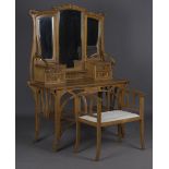 An early 20th century Continental Art Nouveau softwood dressing table and matching stool, in the