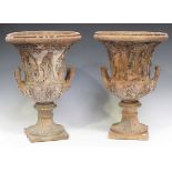 A pair of late 20th century moulded terracotta garden urns of classical twin-handled form, height