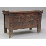 A 19th century Eastern European wooden trunk with overall incised decoration, height 75cm, width