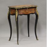 A late 19th century French kingwood and ebonized work table with foliate inlaid decoration, the