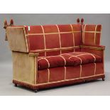 An early 20th century Knole settee, upholstered in pink velour with gilt braid borders, height