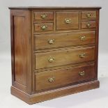 A late Victorian mahogany chest of drawers, fitted with an arrangement of five short drawers above