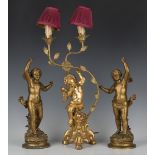 A 20th century gilt composition and wrought metal table lamp in the form of a cherub, height 53cm,