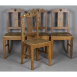 A set of four early 20th century Arts and Crafts style ash dining chairs, the top rails with pierced