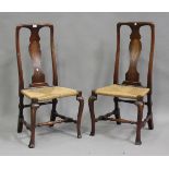 A pair of early 18th century walnut splat back side chairs, each with inlaid panels above woven