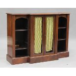 A 19th century mahogany breakfront bookcase cabinet, enclosed by two trellis panel doors, flanked by