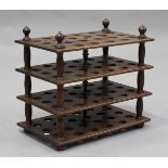 A late Victorian mahogany four-tier egg rack, pierced to hold eight-eight eggs, height 45cm, width