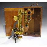 A late 19th century enamelled and lacquered brass binocular microscope, signed 'Henry Crouch London'