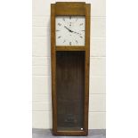 A mid-20th century IBM International Electric oak cased master clock, the signed painted square dial