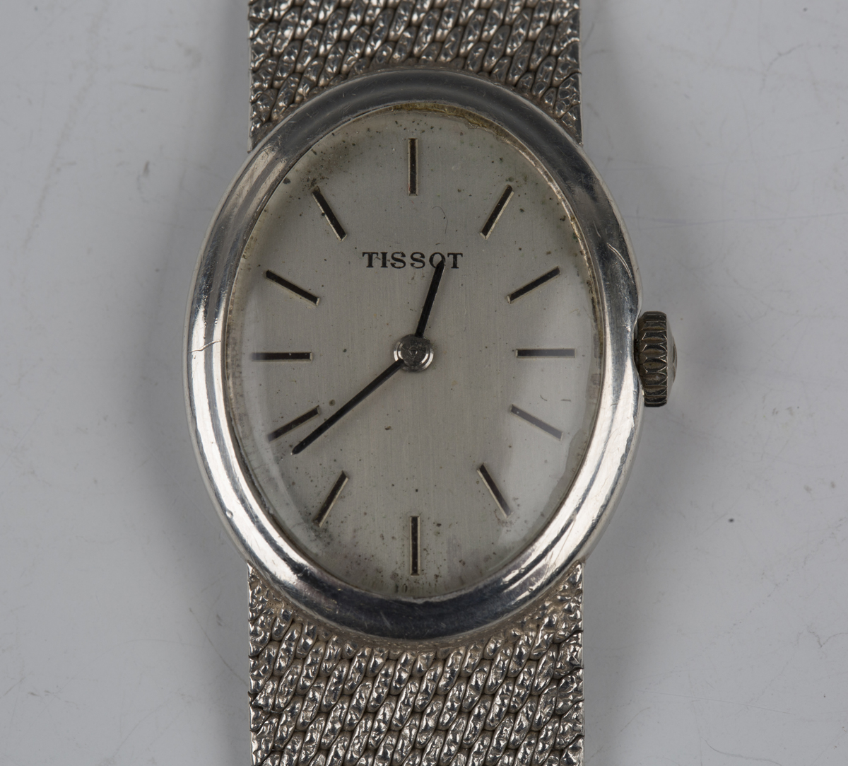 A Tissot silver cased lady's bracelet wristwatch with jewelled movement, the signed silvered oval