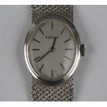 A Tissot silver cased lady's bracelet wristwatch with jewelled movement, the signed silvered oval