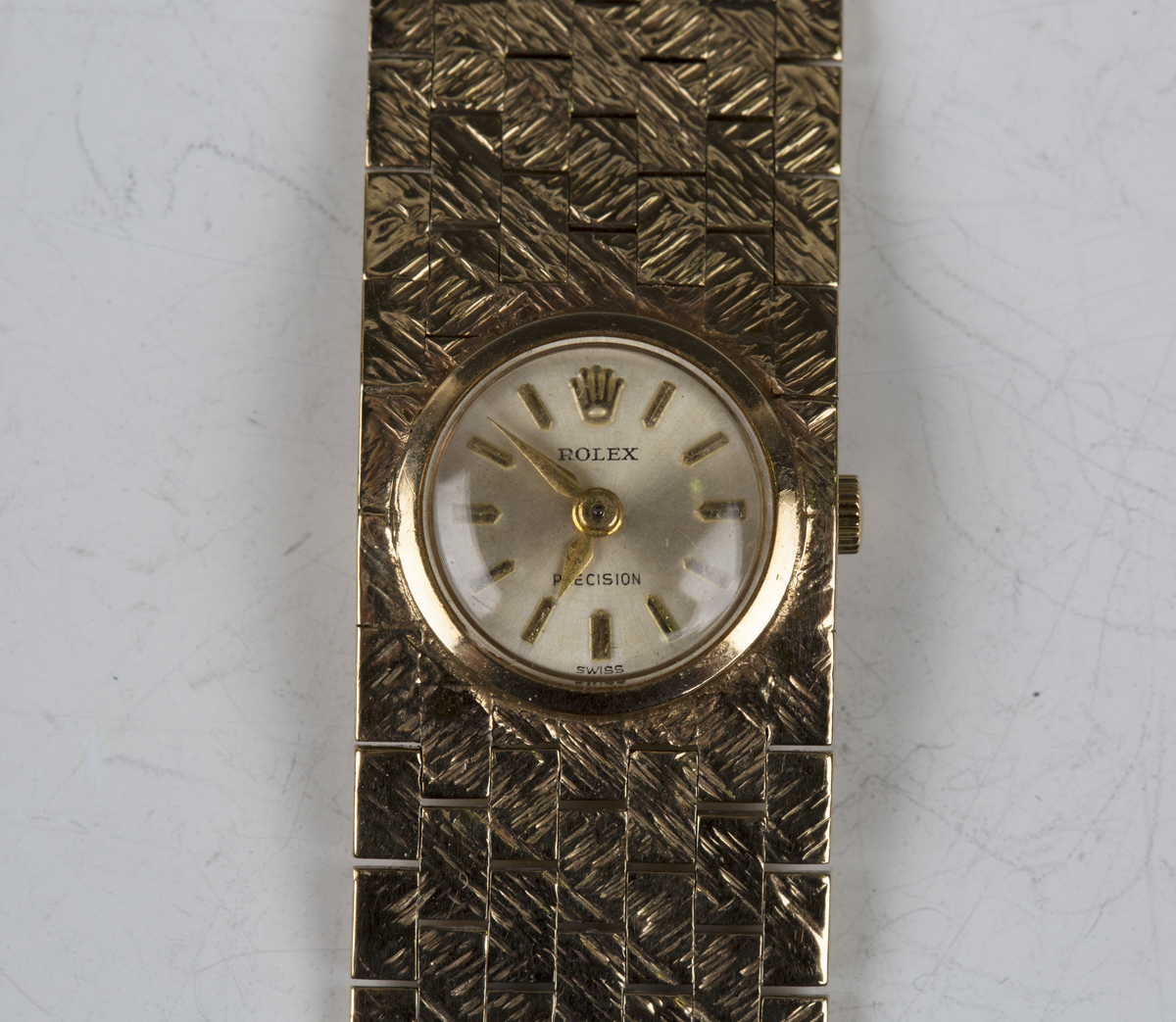 A Rolex Precision 9ct gold cased lady's bracelet wristwatch with signed jewelled movement, the