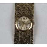 A Rolex Precision 9ct gold cased lady's bracelet wristwatch with signed jewelled movement, the