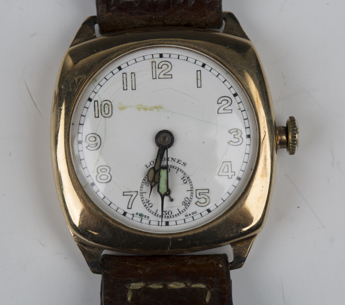 A Longines 9ct gold cushion cased gentleman's wristwatch, the signed jewelled lever movement