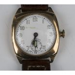 A Longines 9ct gold cushion cased gentleman's wristwatch, the signed jewelled lever movement