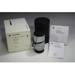 A Leica Elmarit-M 1:2.8/90 lens, No. 3805929, circa 1997, with silver chrome finish, boxed, with