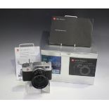 A Leica Digilux 2 camera, No. 3013830, with DC Vario-Summicron 1:2.0-2.4/7-22.5 ASPH lens, lens