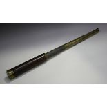 A late 19th century brown leather bound brass three-draw telescope, signed 'Dollond London',