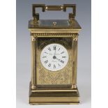 A late 20th century lacquered brass cased carriage clock with eight day jewelled movement striking