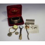 A gold cased keyless wind open-faced fob watch with unsigned movement, gilt base metal inner case,