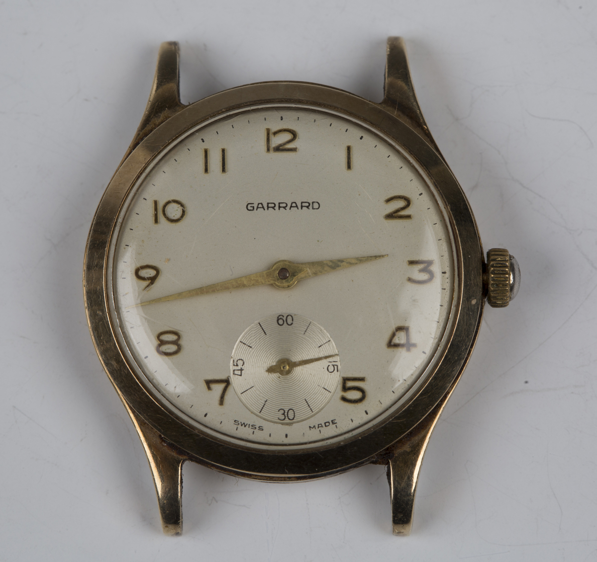 A Garrard 9ct gold cased gentleman's wristwatch with signed jewelled movement, the signed silvered