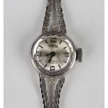 A Tourist white gold and diamond lady's bracelet wristwatch, the signed silvered circular dial