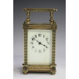 A late 19th/early 20th century lacquered brass carriage timepiece with eight day movement, the