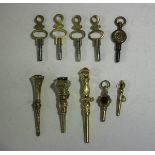 A group of five mostly Victorian watch keys, including a European gold cased key, length 5.2cm, a