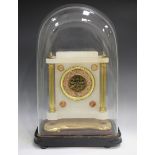 A late 19th century alabaster and brass mantel timepiece, the dial with Arabic hour numerals, the
