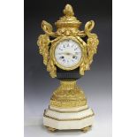A late 19th century French ormolu, black patinated and white marble mantel clock, the eight day