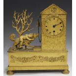 An early 19th century French ormolu mantel timepiece, the drum cased movement with silk