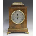 A 19th century gilt brass mounted rosewood mantel clock with eight day movement striking on a
