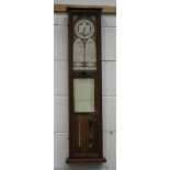 A late Victorian oak cased 'The Fitzroy Aneroid' barometer with printed paper dial, the